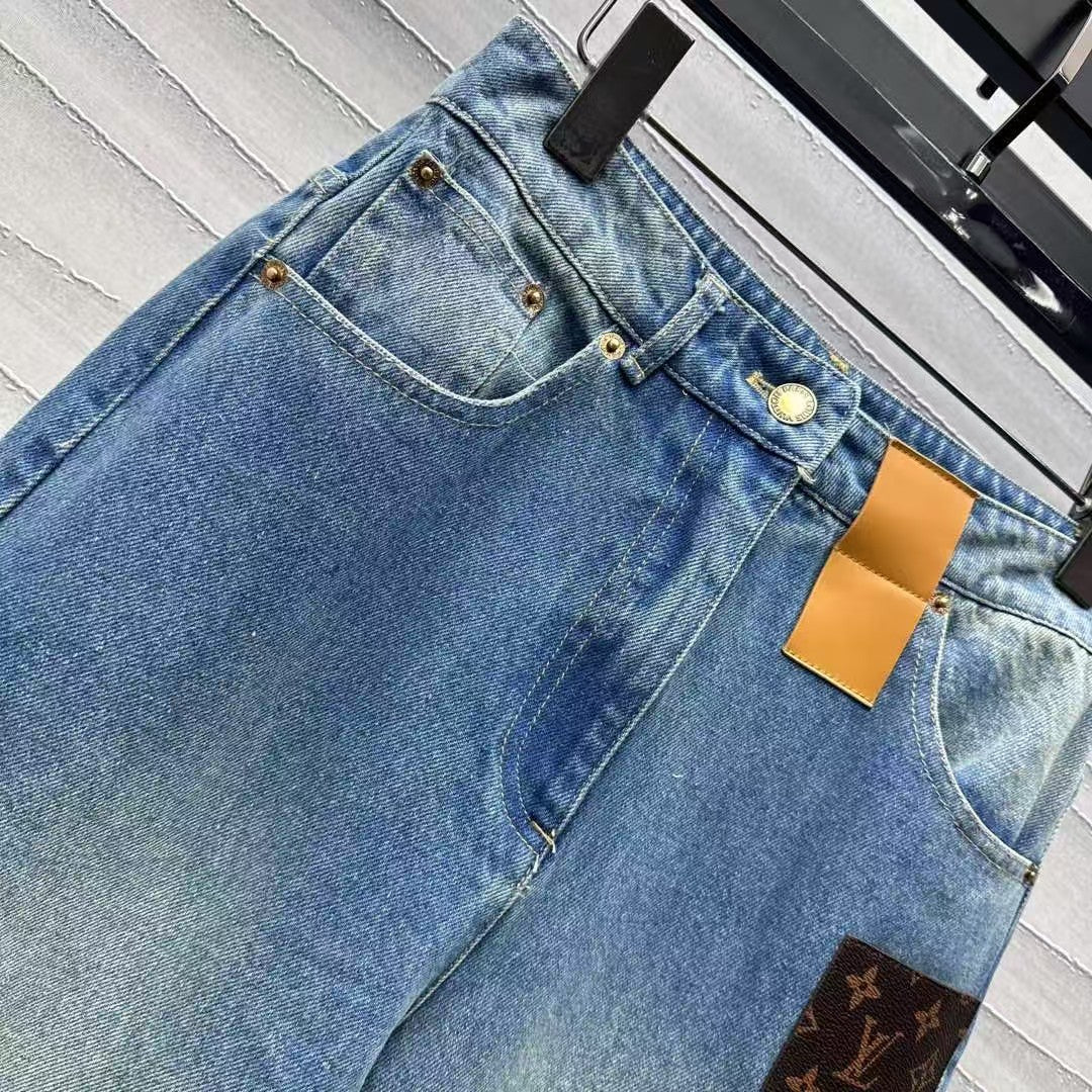 Leather brand denim trousers