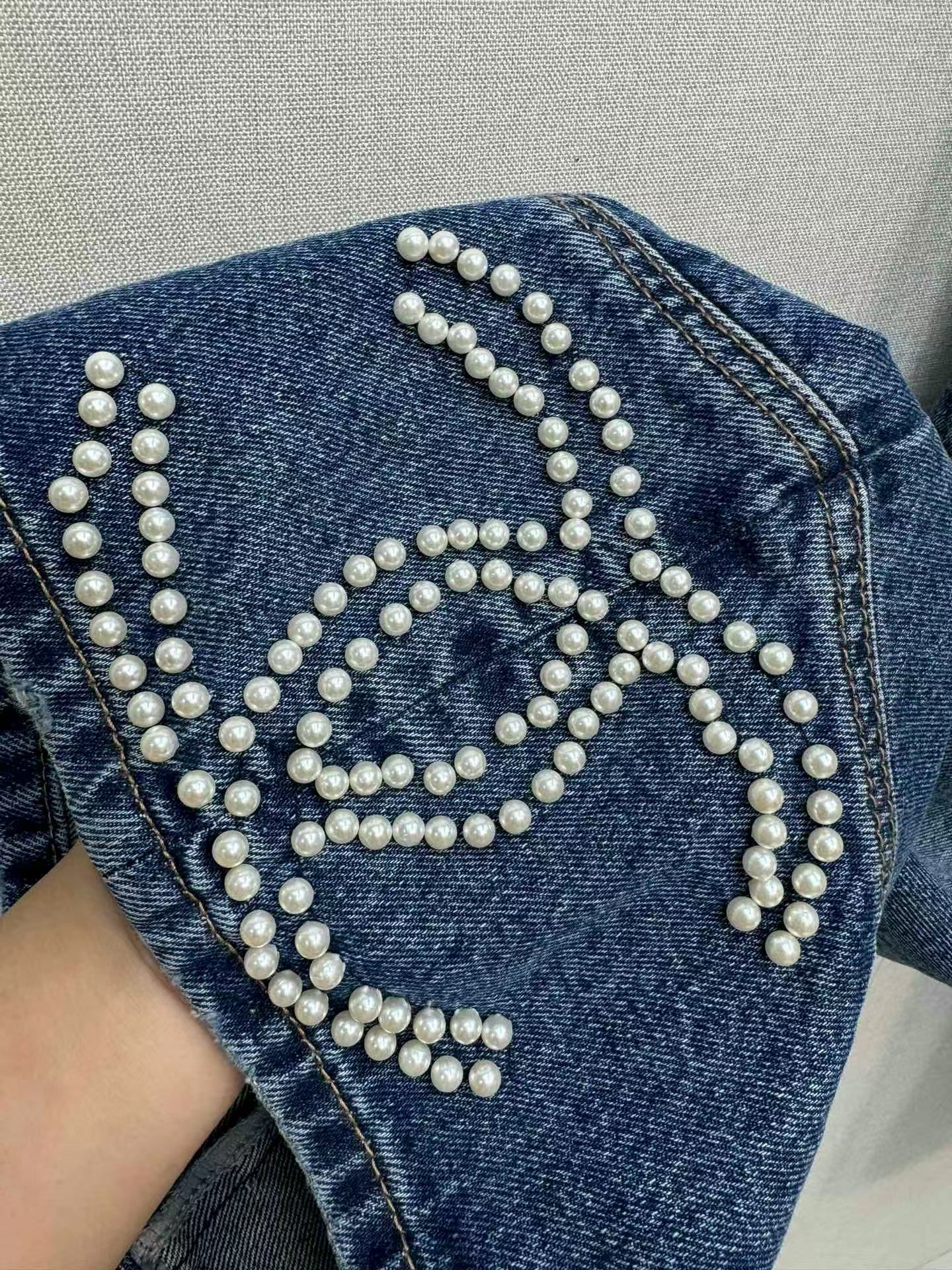Jeans with handmade pearl embellishments