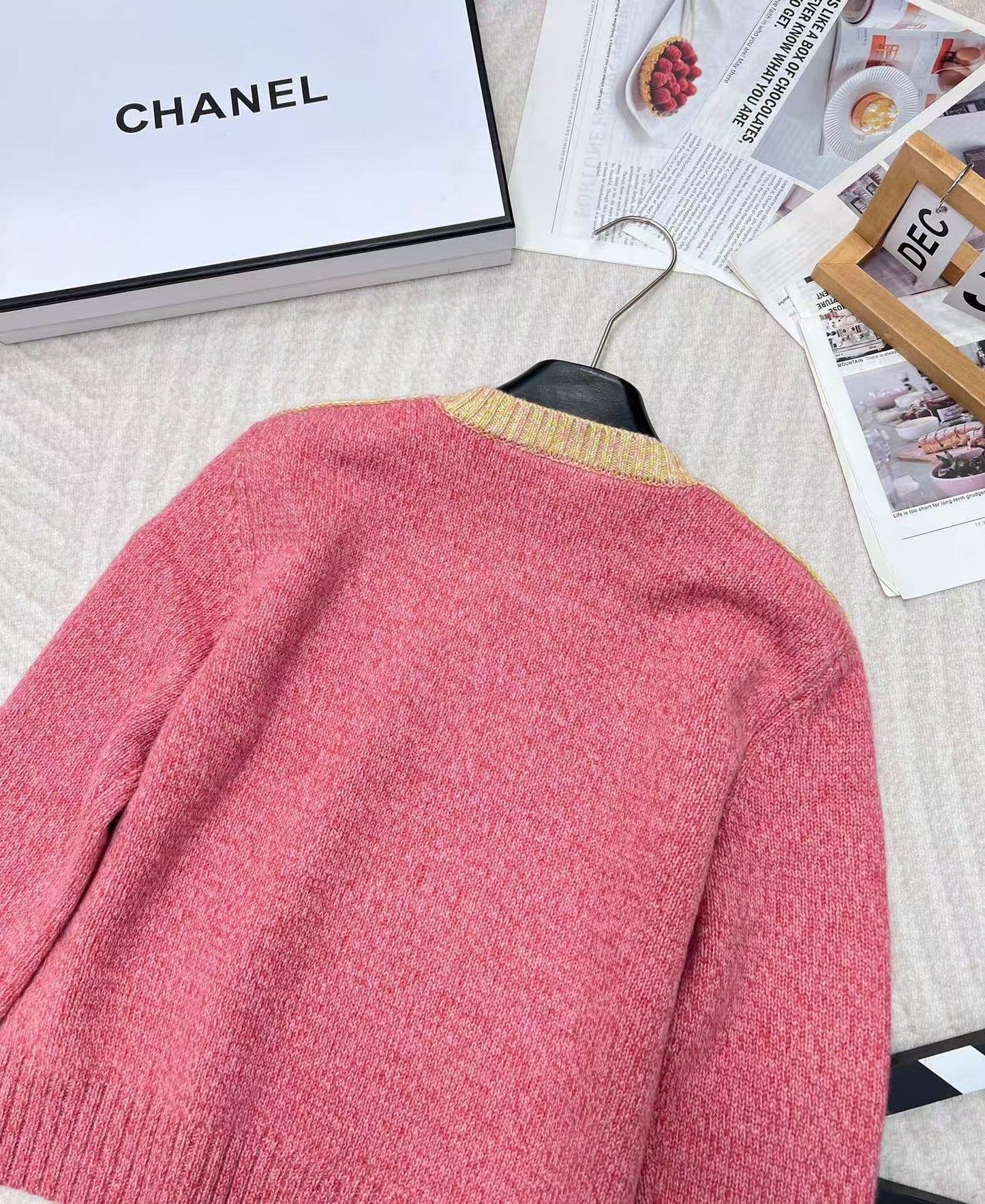 Pink jacquard knit long sleeves with dropped shoulders and button detail