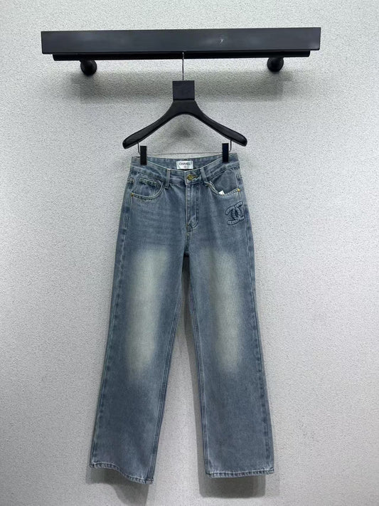 Denim trousers with embossed logo on pocket