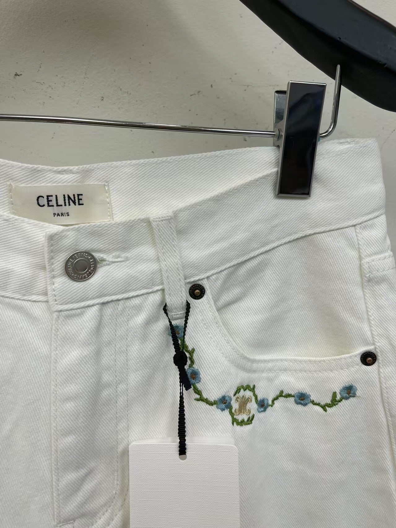 White denim shorts with embroidered letters