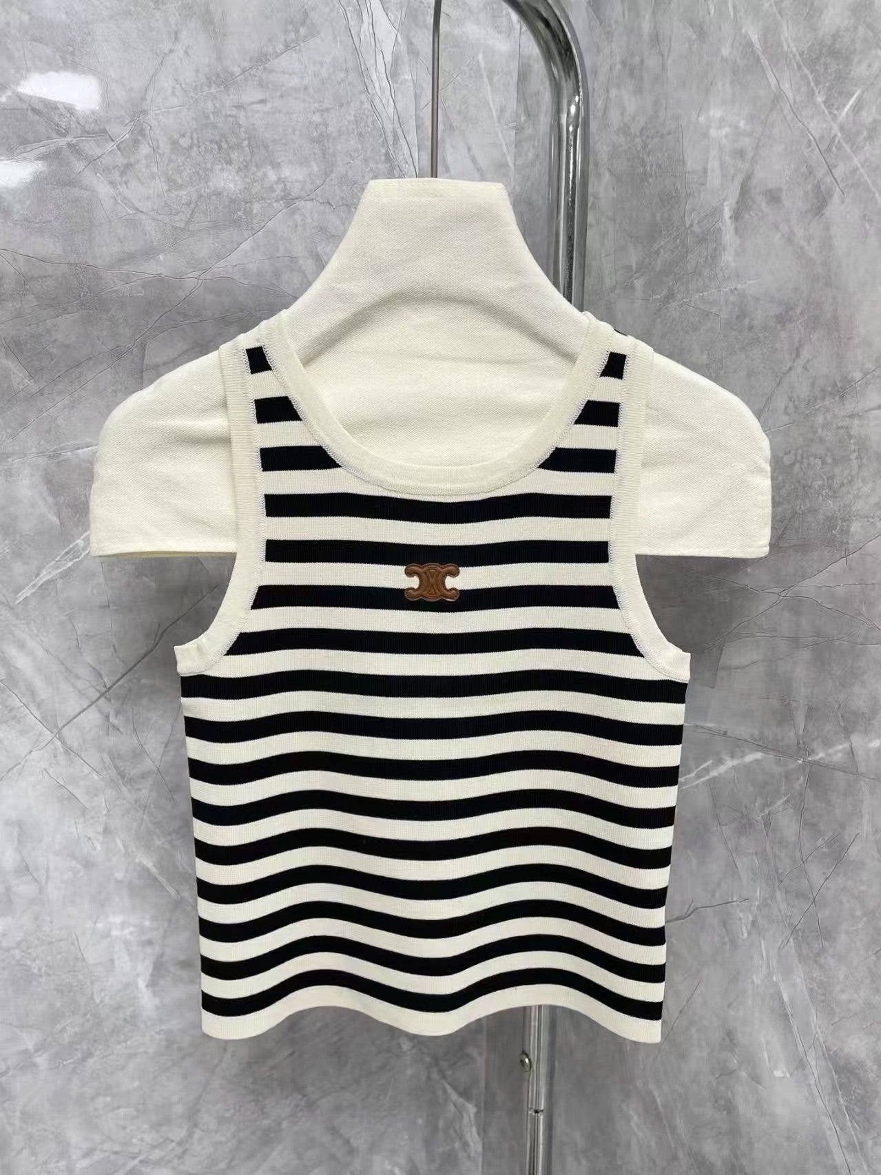 New contrast striped vest