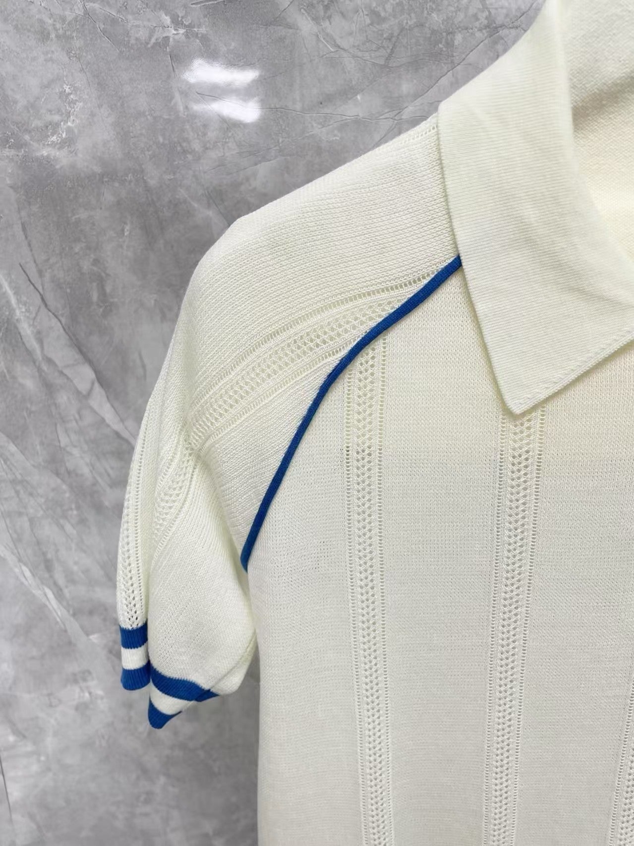 white knitted short-sleeved shirt