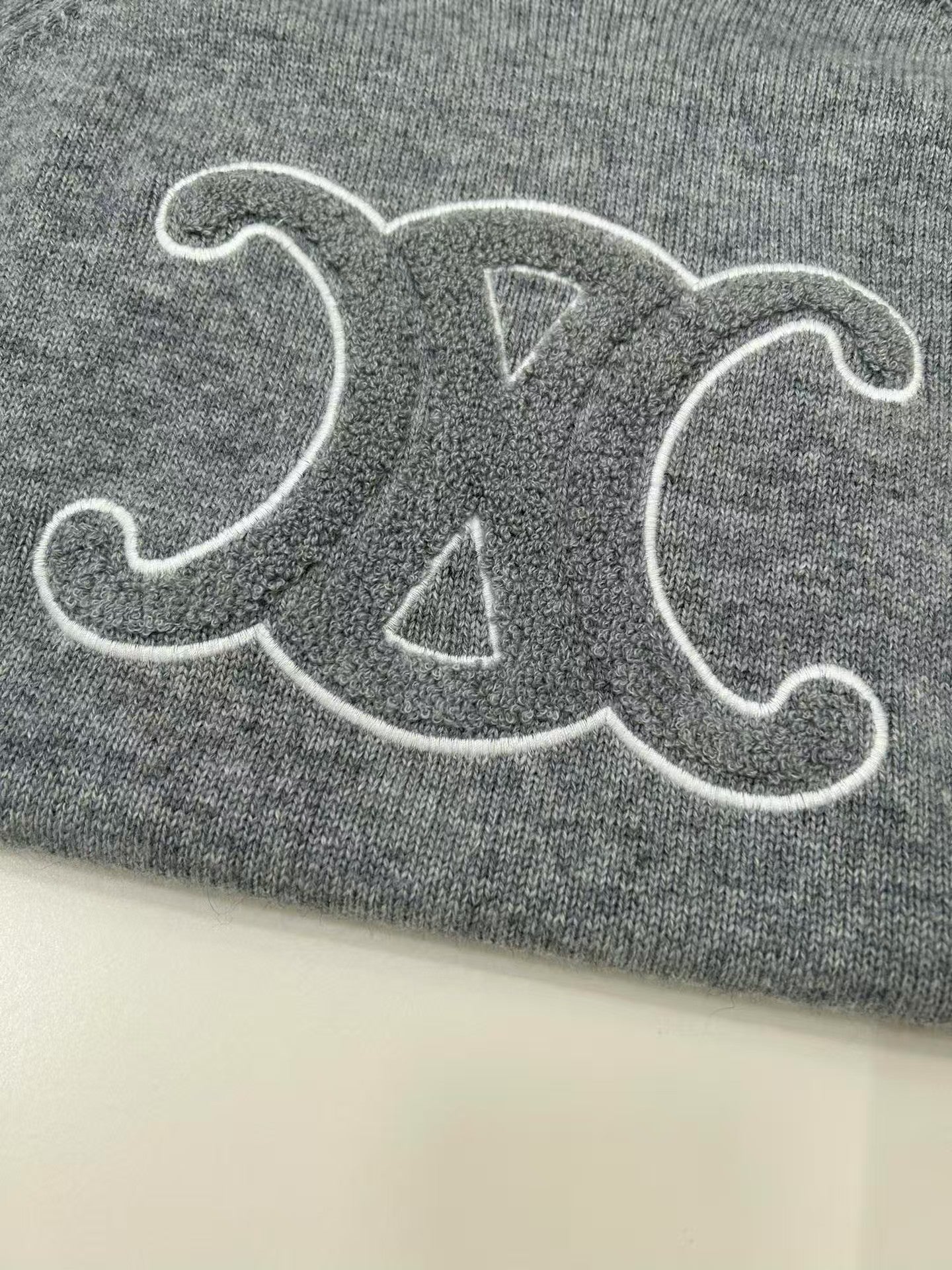 Terry-embroidered Arc de Triomphe hooded wool sweater