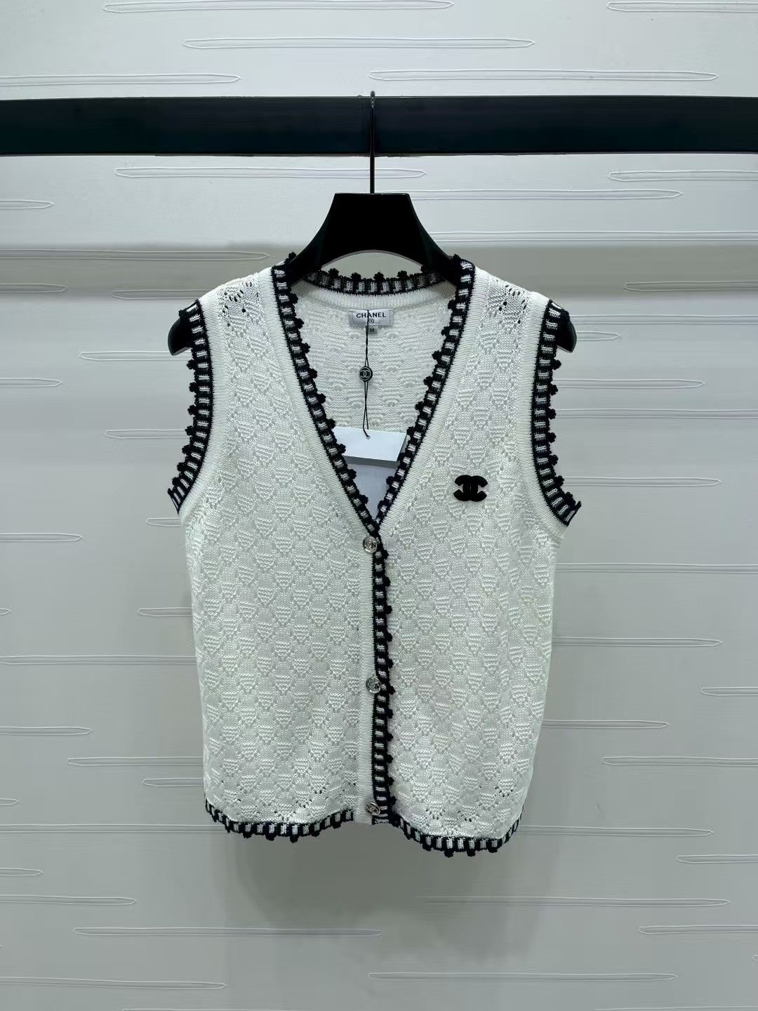 Lace-trimmed knitted vest
