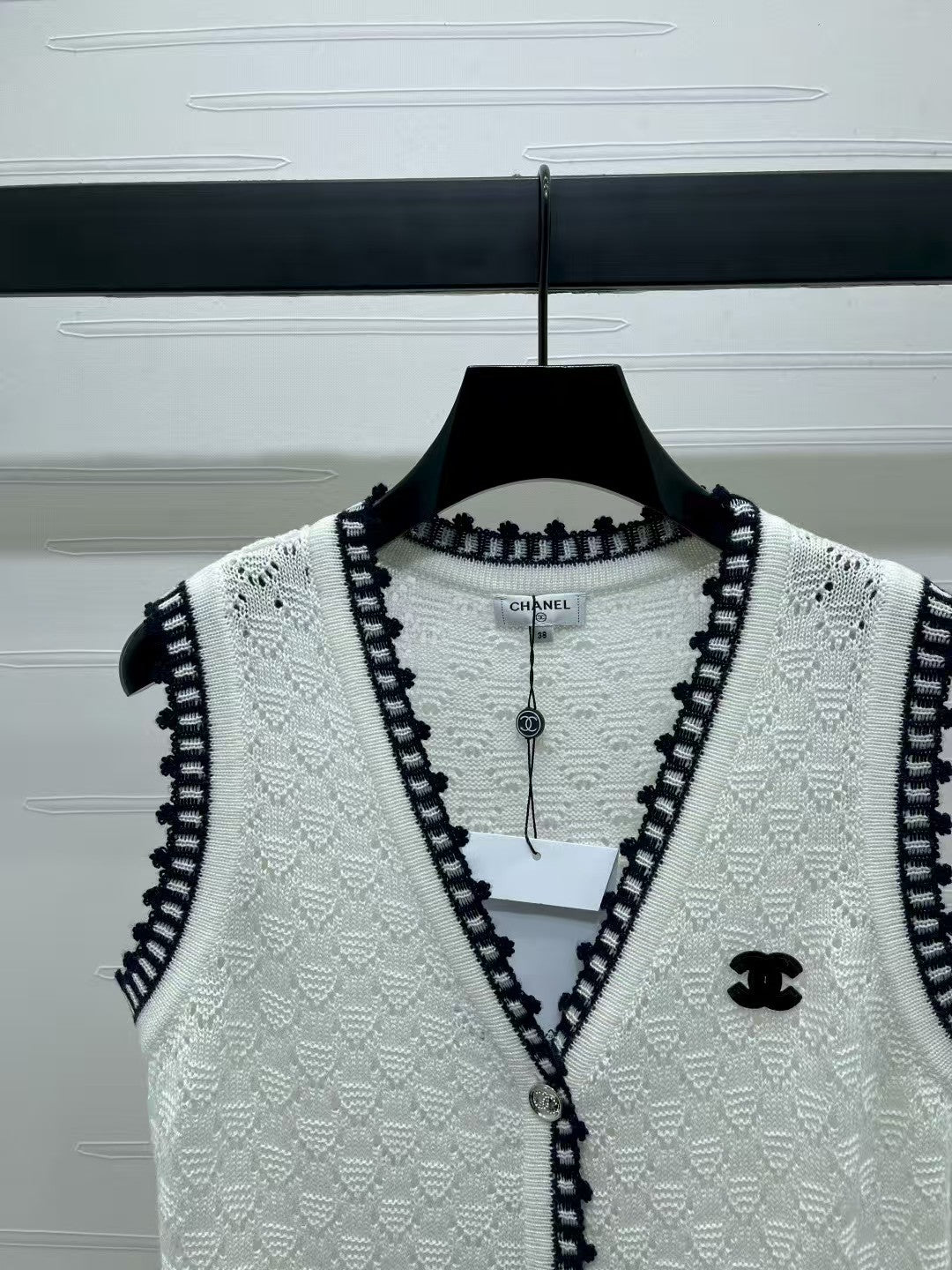 Lace-trimmed knitted vest