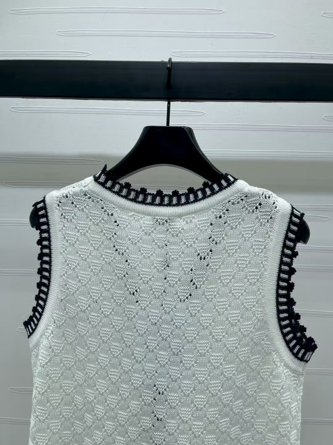 Lace-trimmed knitted vest