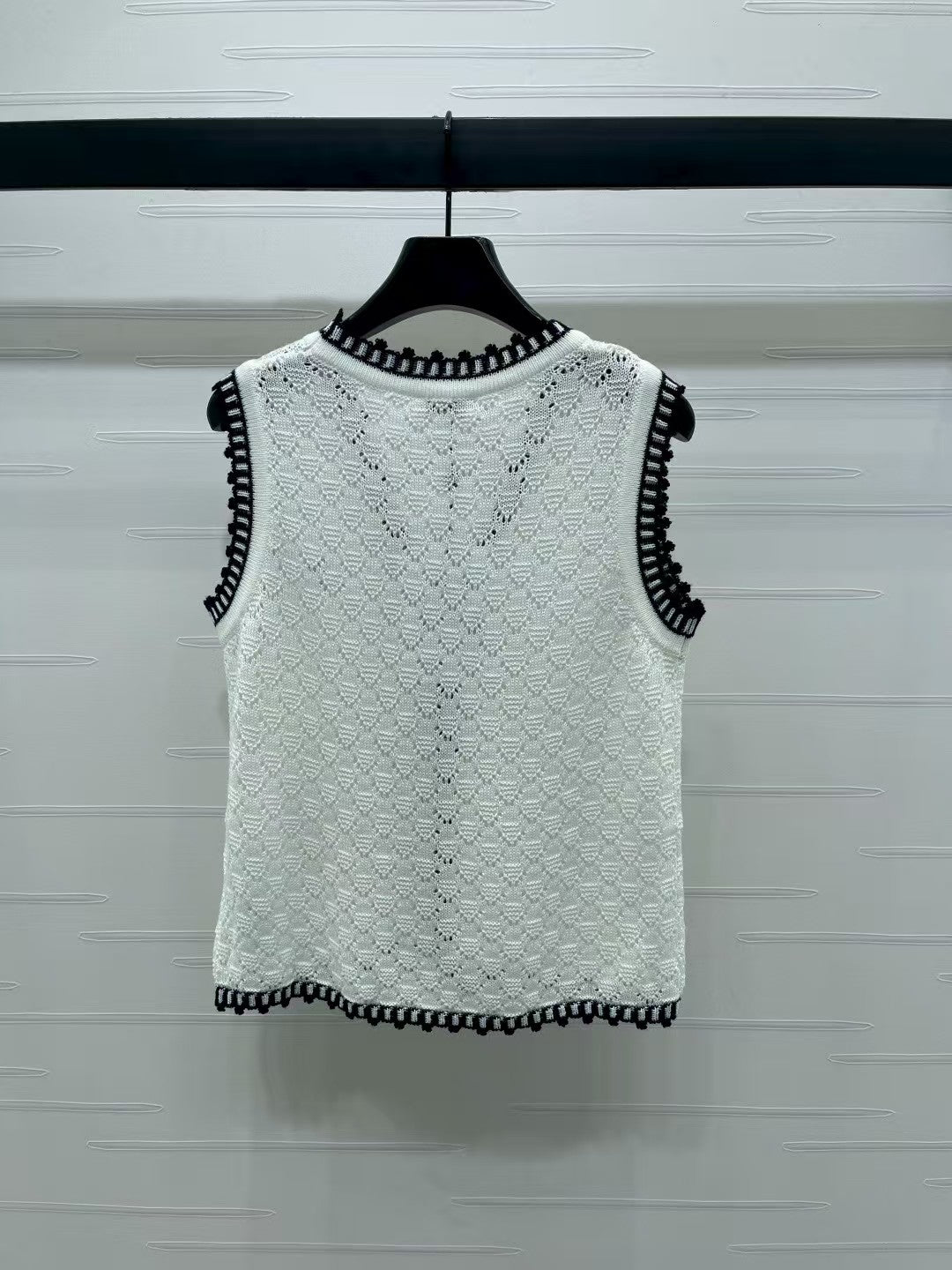 Lace-trimmed knitted vest