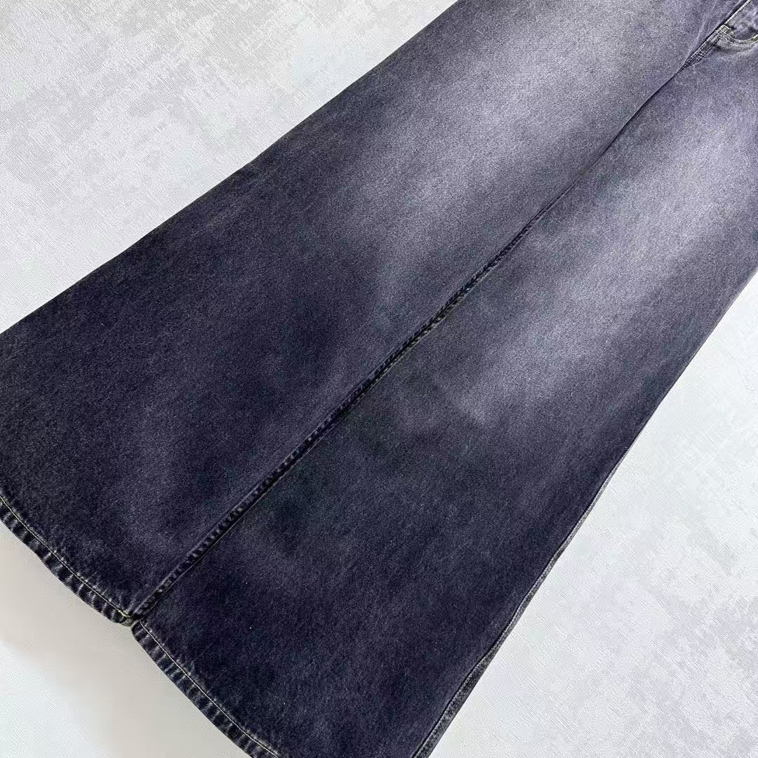 High-waisted bleached denim trousers