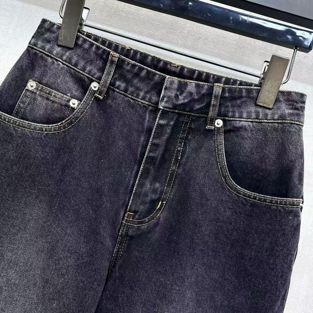 High-waisted bleached denim trousers