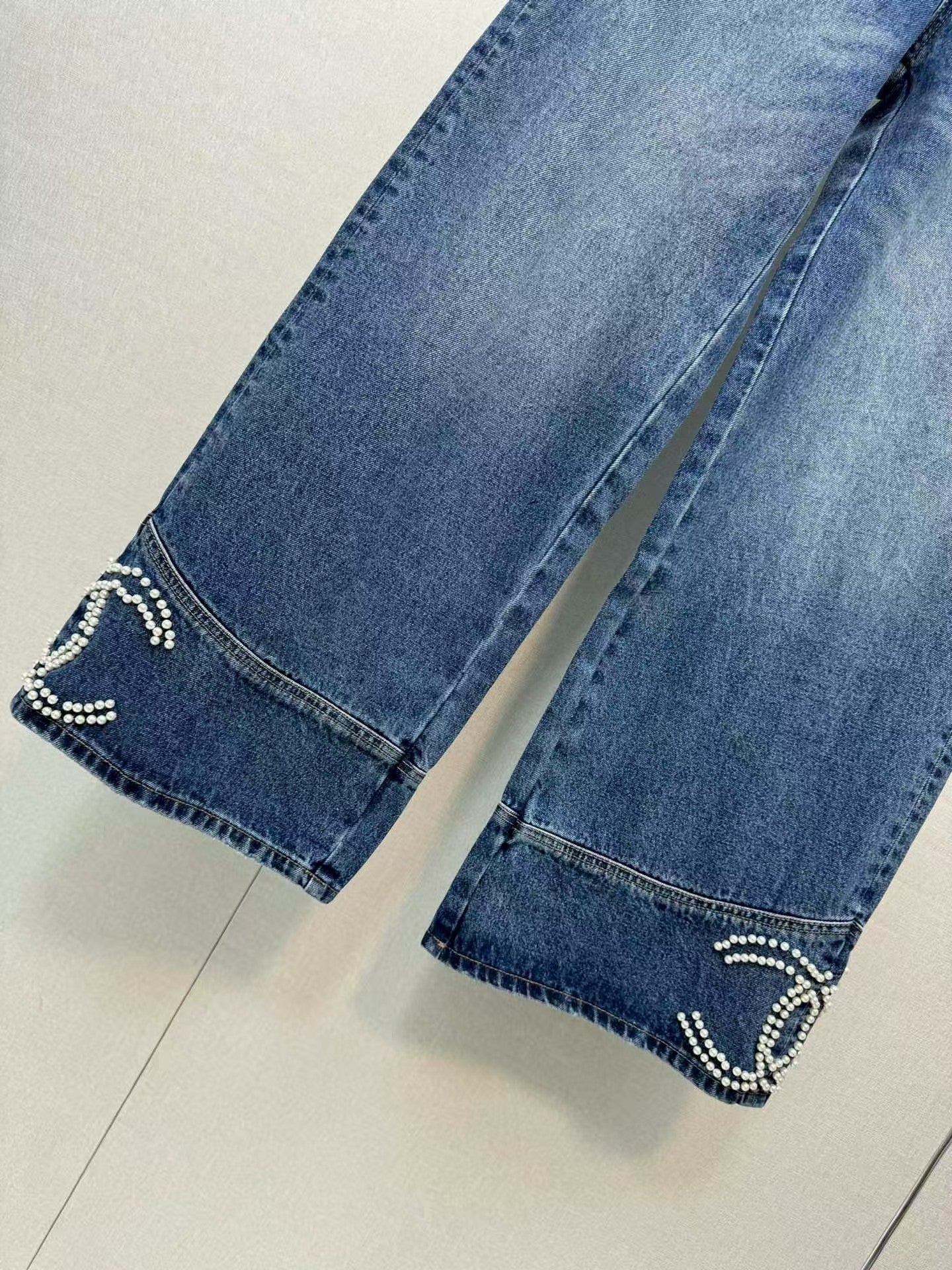 Jeans with handmade pearl embellishments