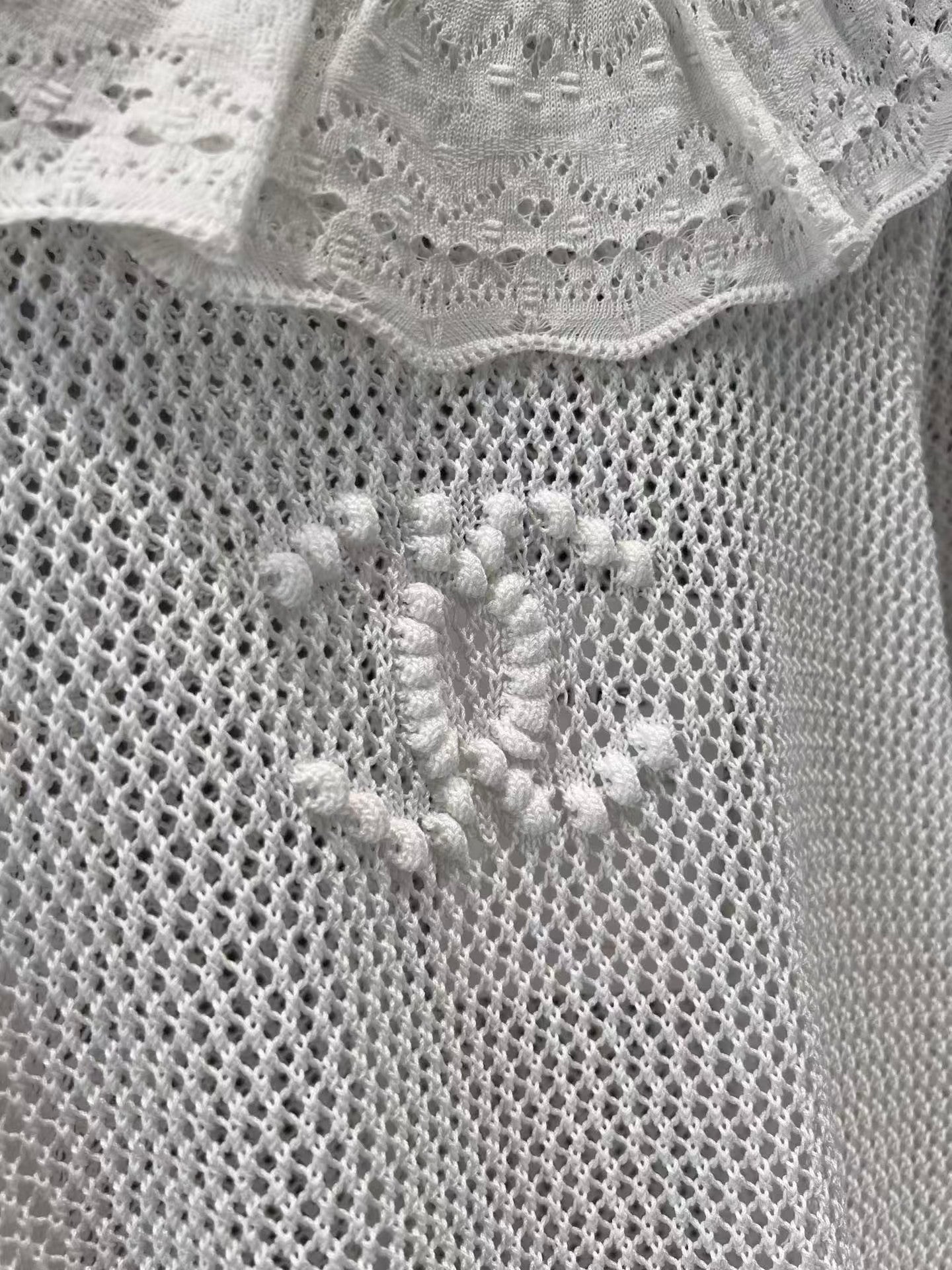 Ruffled collar hollow trumpet sleeve knitted top