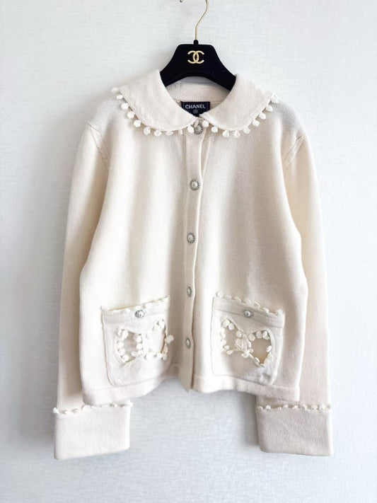 New openwork pocket Peter Pan collar cardigan