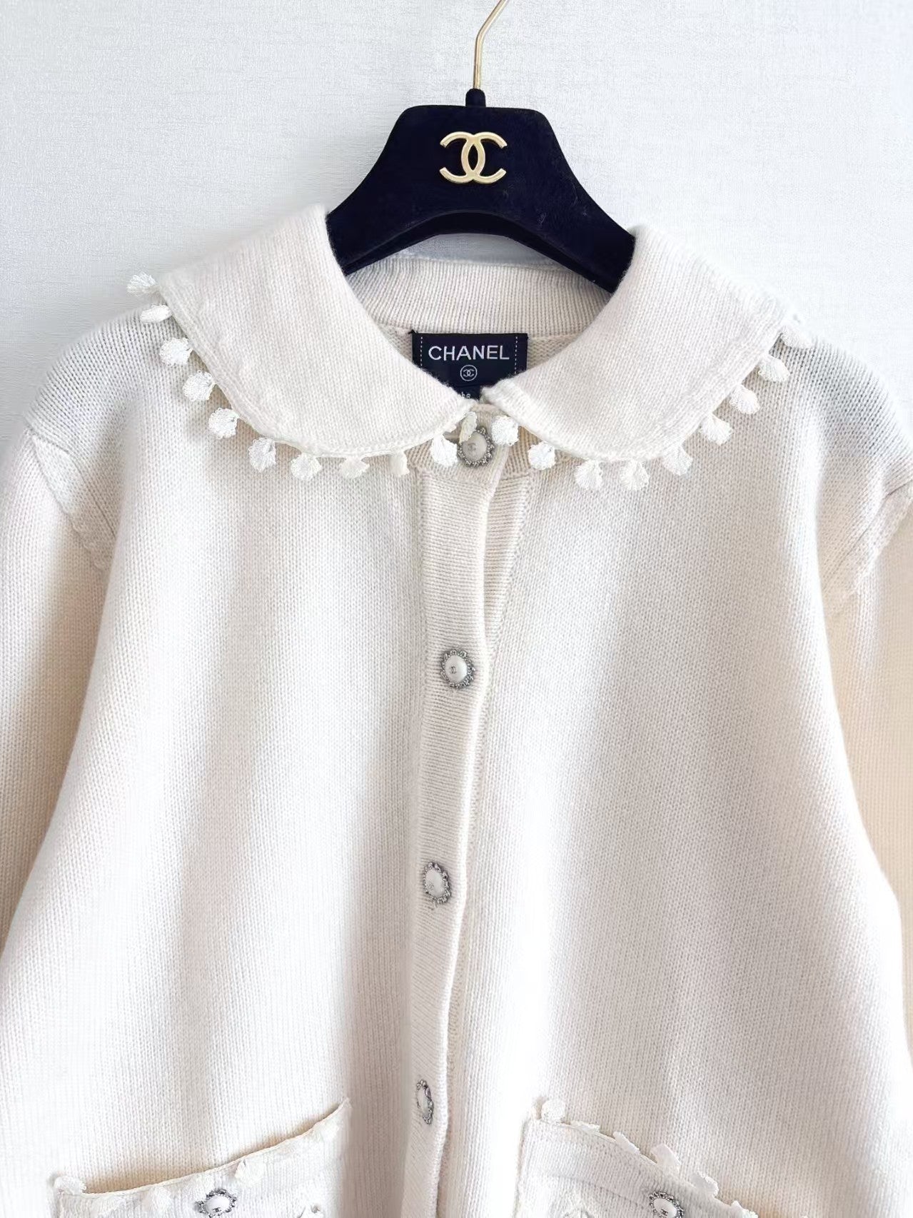 New openwork pocket Peter Pan collar cardigan