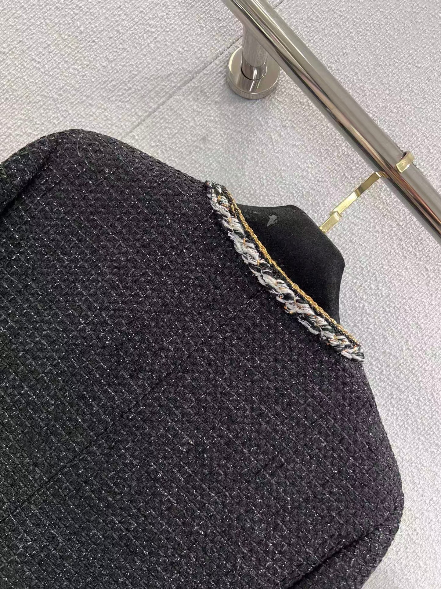 Black and gold four-pocket tweed coat