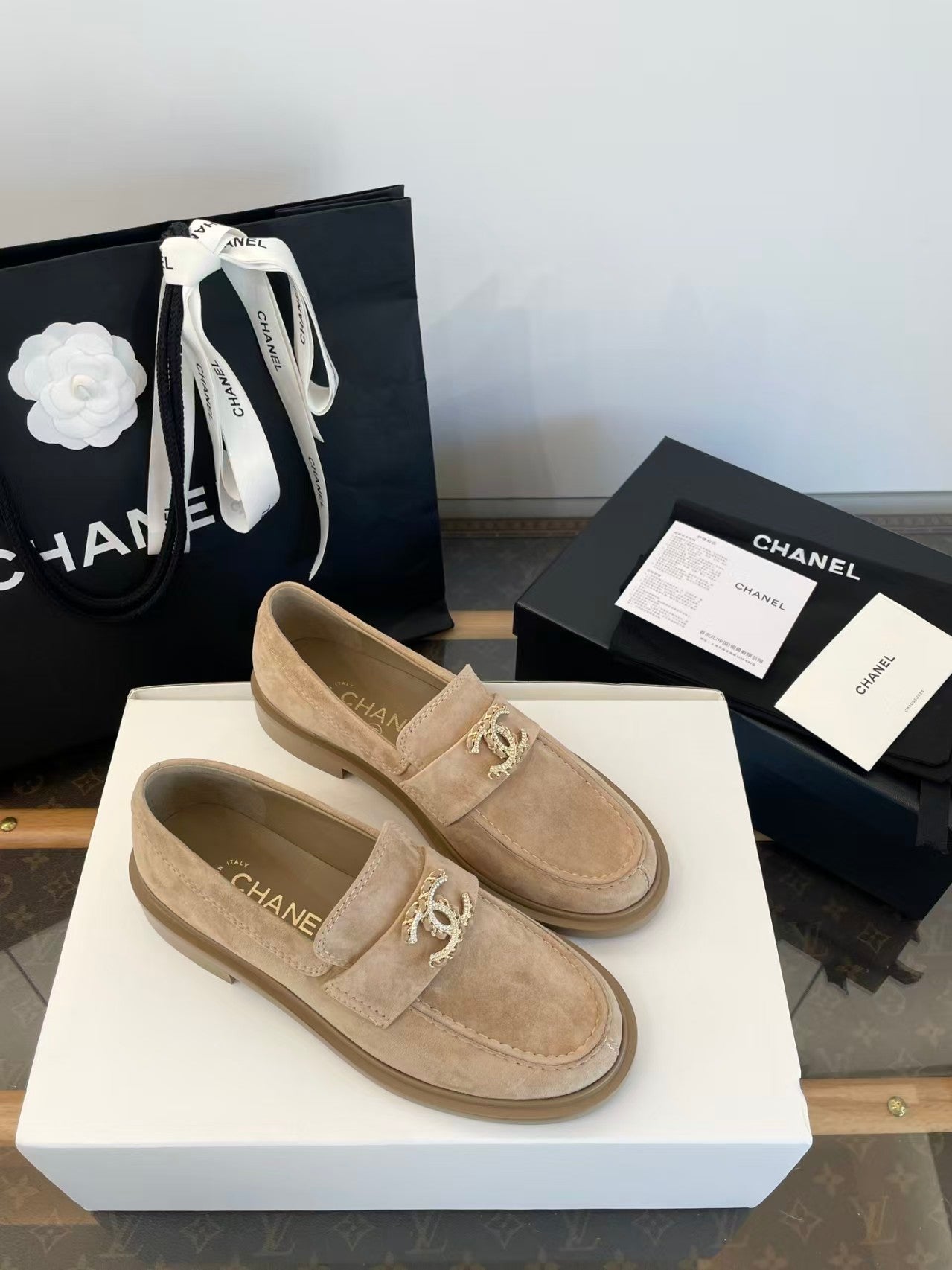 Gold buckle suede loafers
