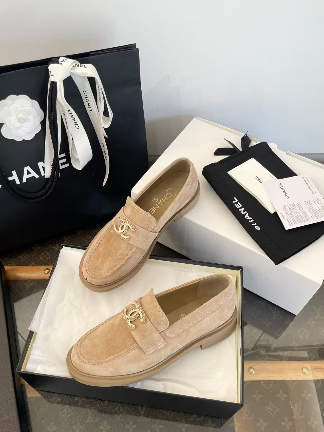 Gold buckle suede loafers