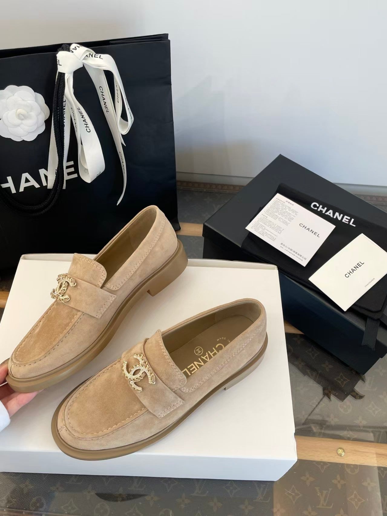 Gold buckle suede loafers