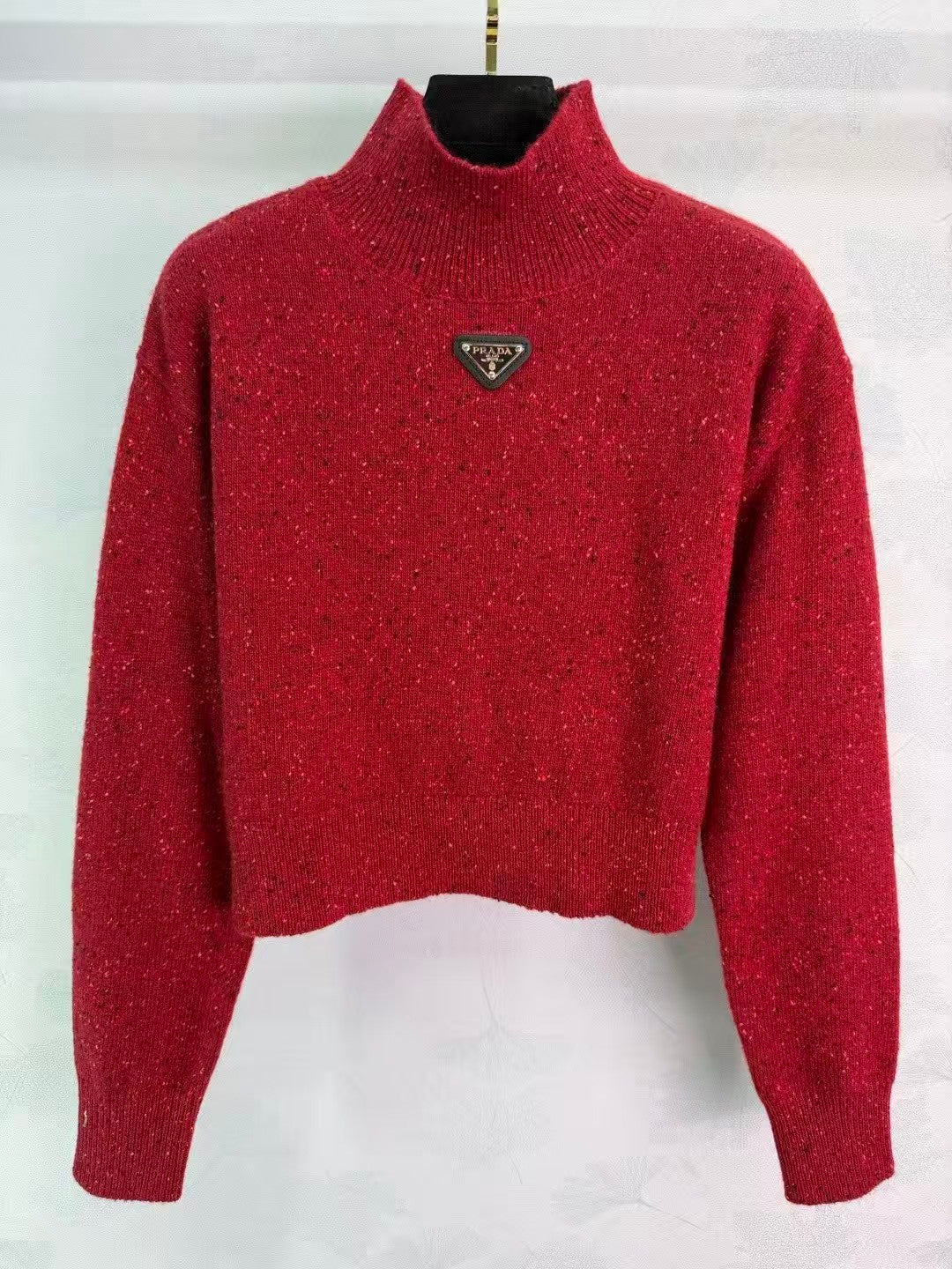 Stand-up collar triangular logo sweater
