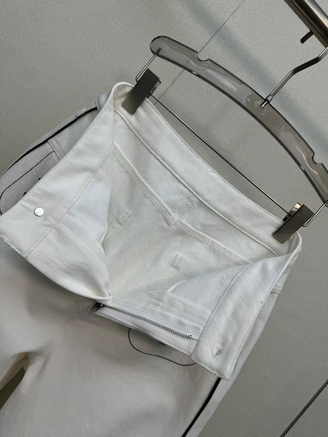 New double-C white denim jeans