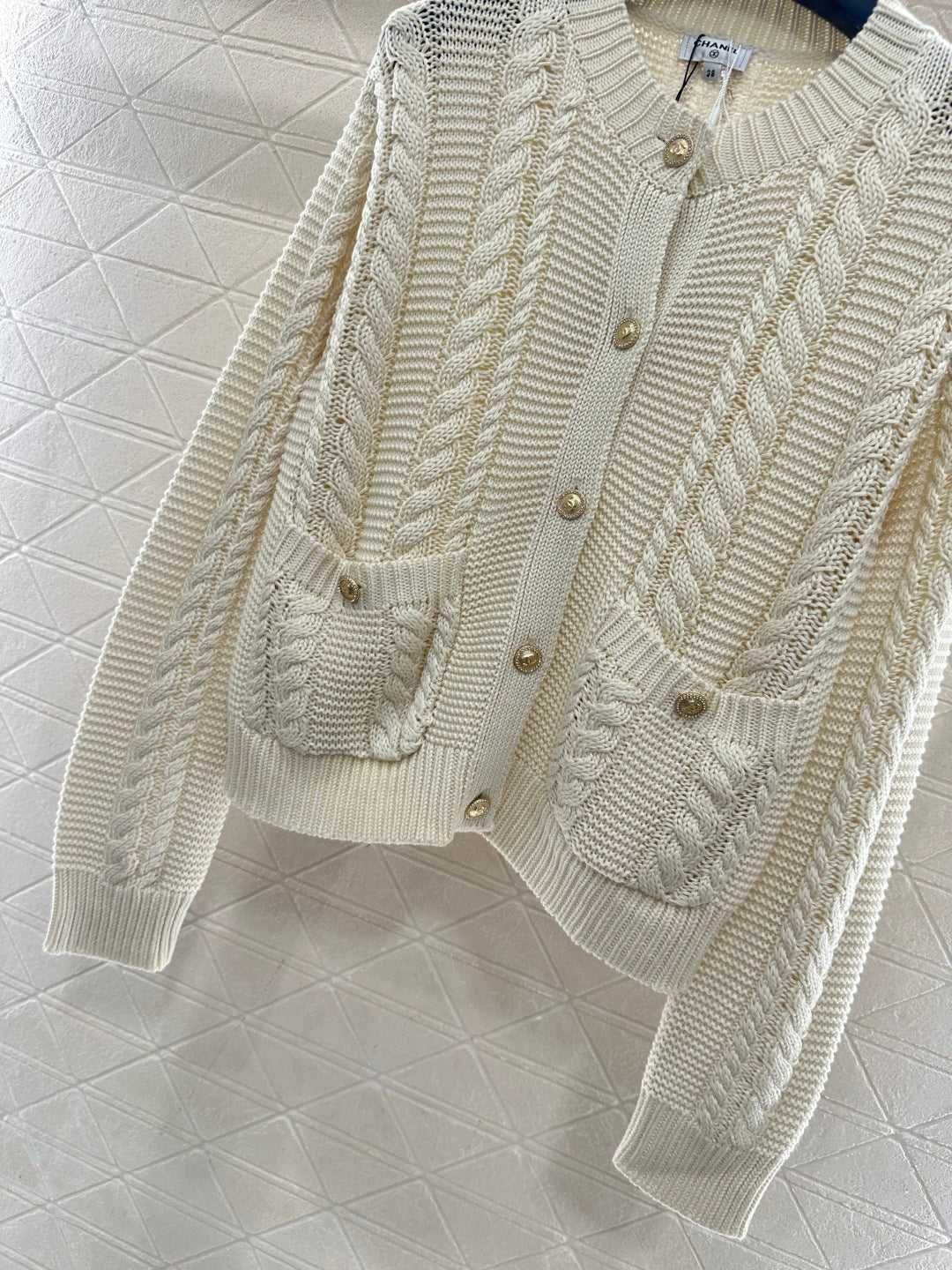 Round-neck cable knit cardigan