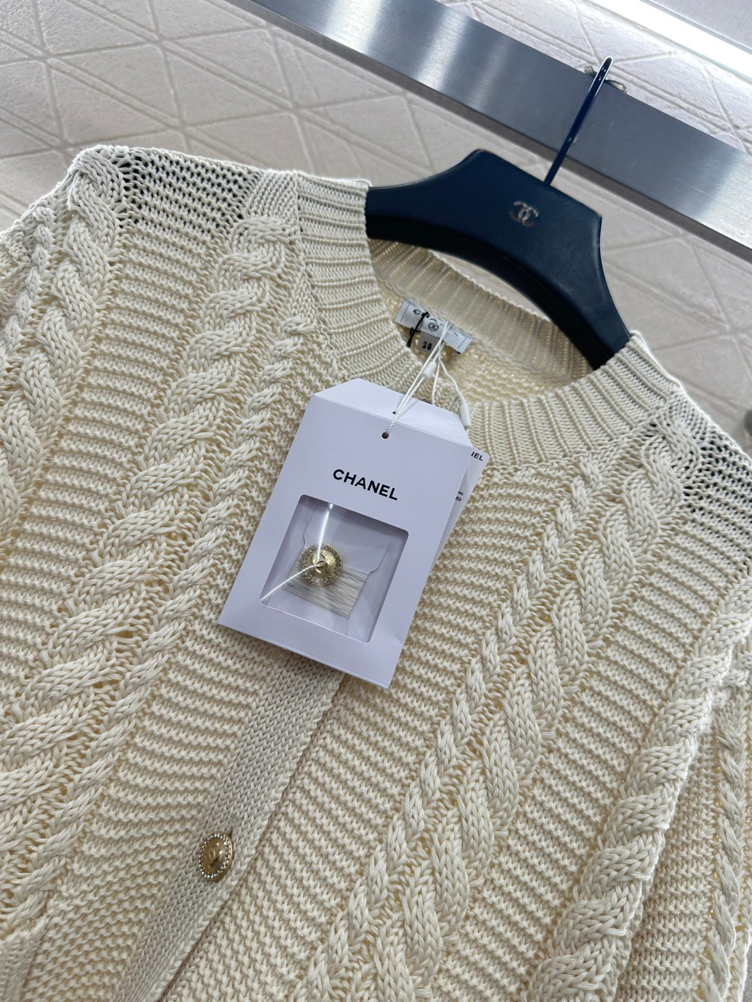 Round-neck cable knit cardigan