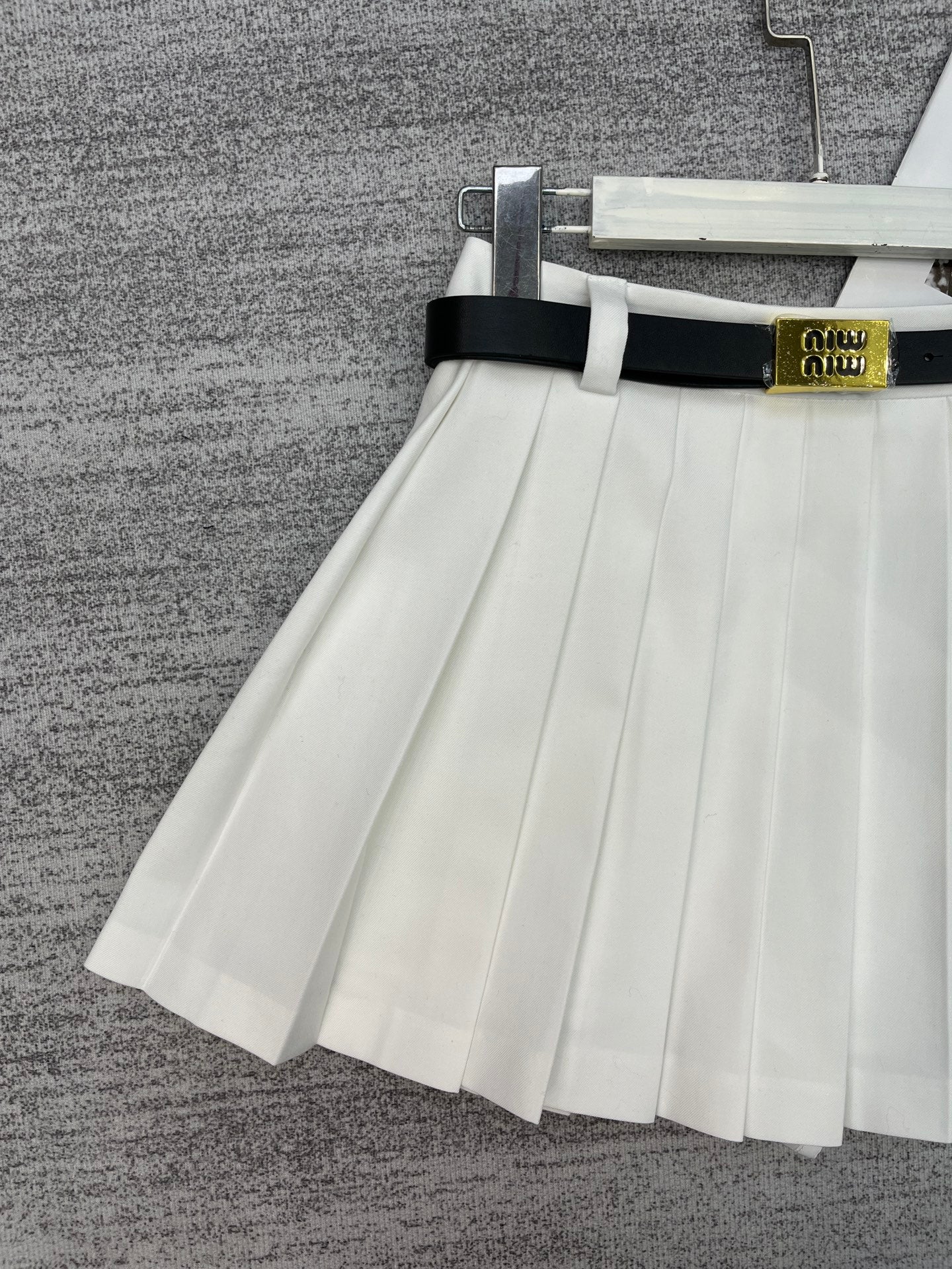 New style pleated skirt with belt.