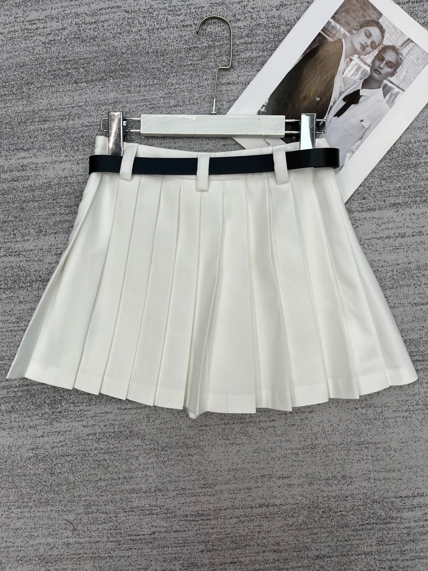 New style pleated skirt with belt.