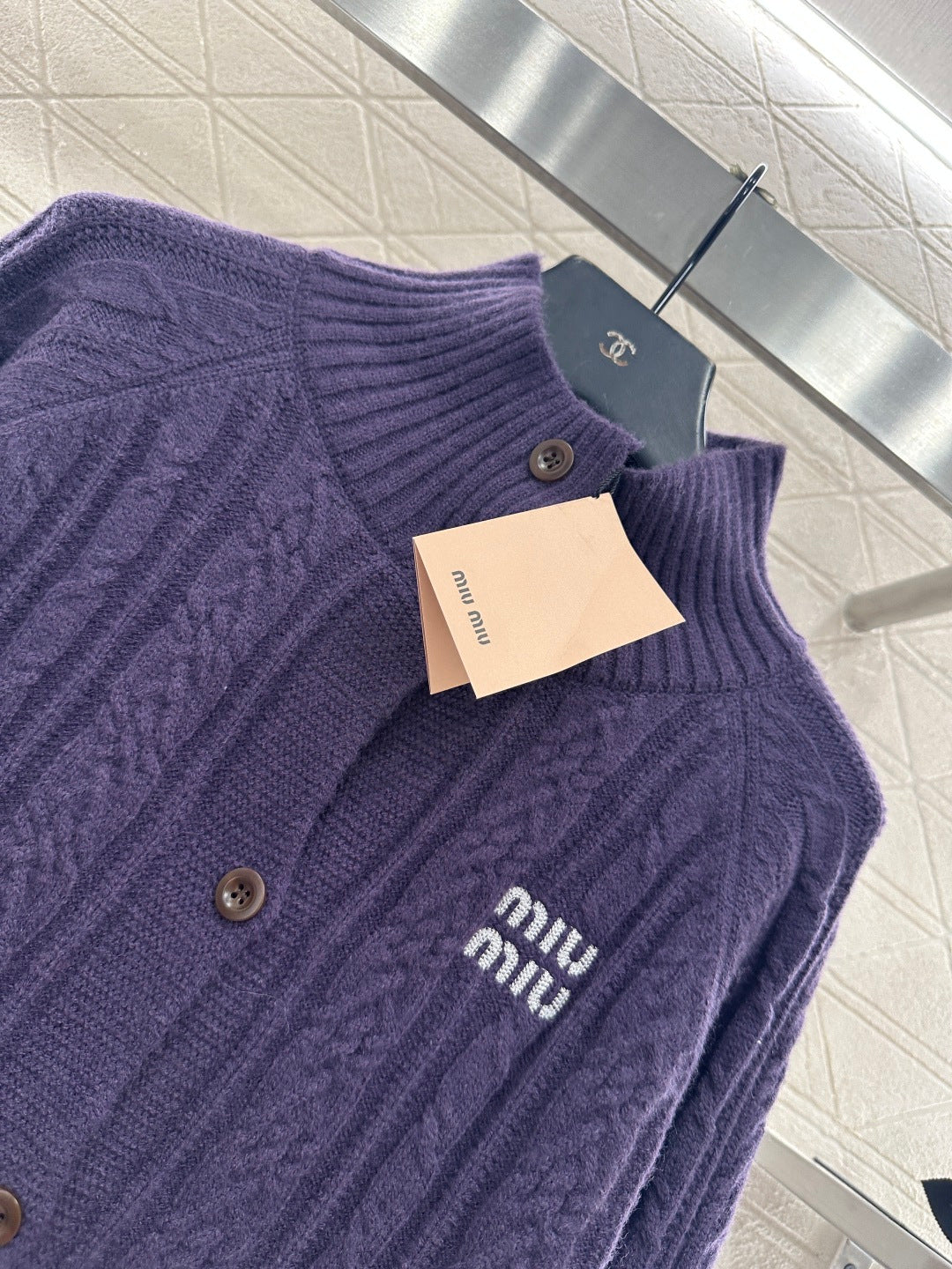 Cable knit cardigan with logo