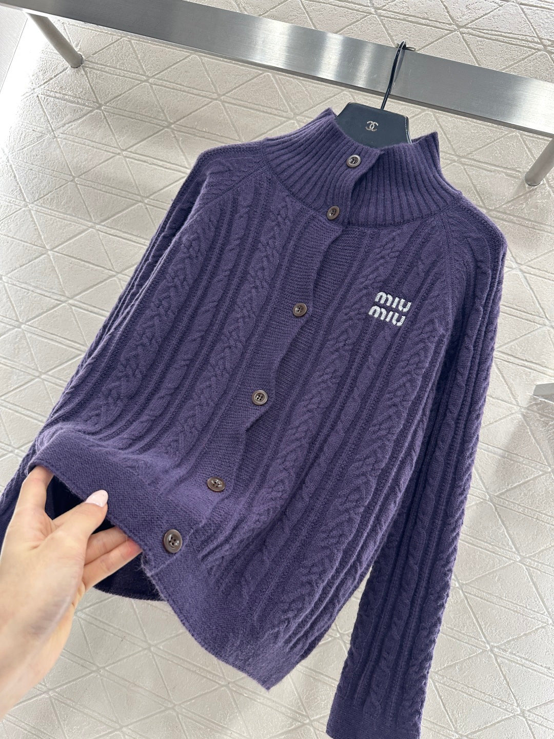 Cable knit cardigan with logo