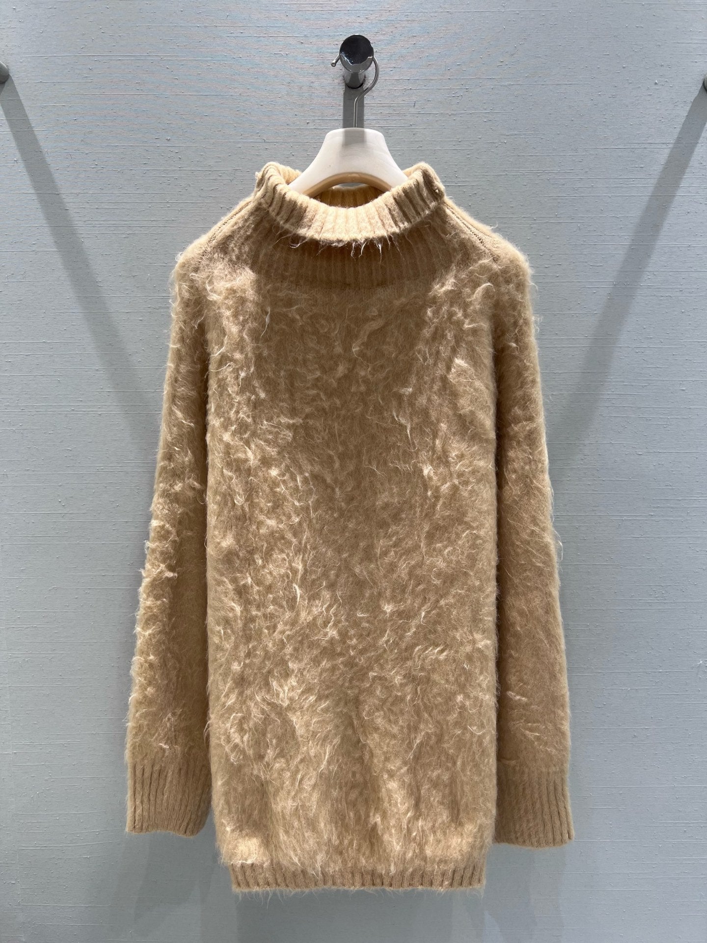 New camel-colored knitted sweater