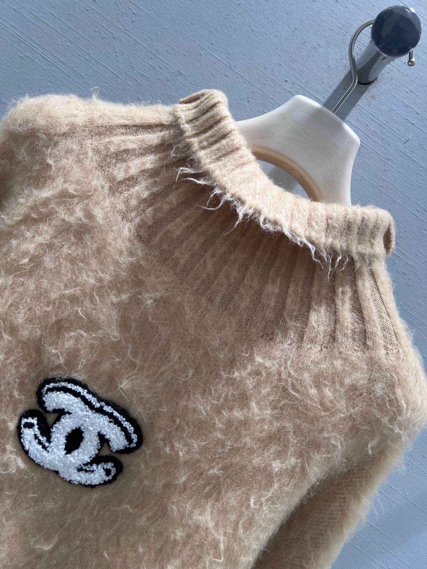 New camel-colored knitted sweater