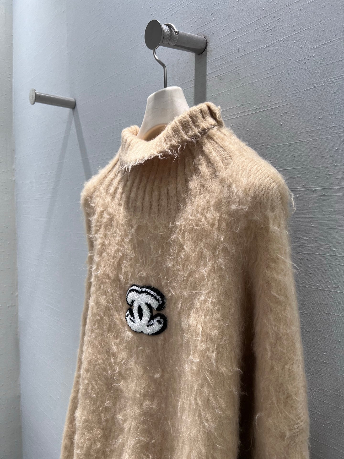 New camel-colored knitted sweater