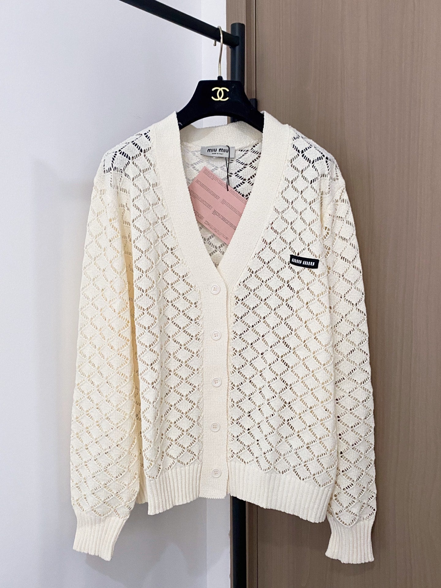 Cardigan embellished with logo details.