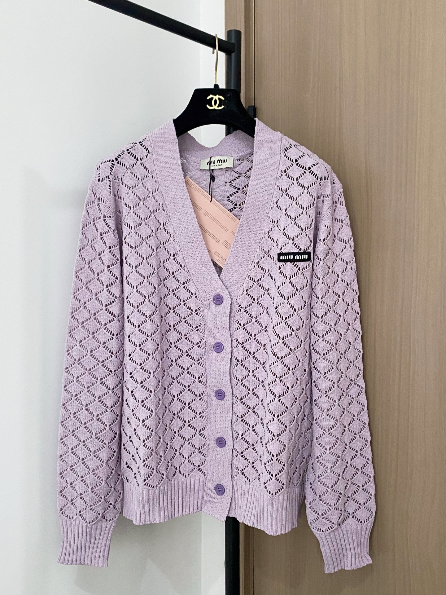 Cardigan embellished with logo details.