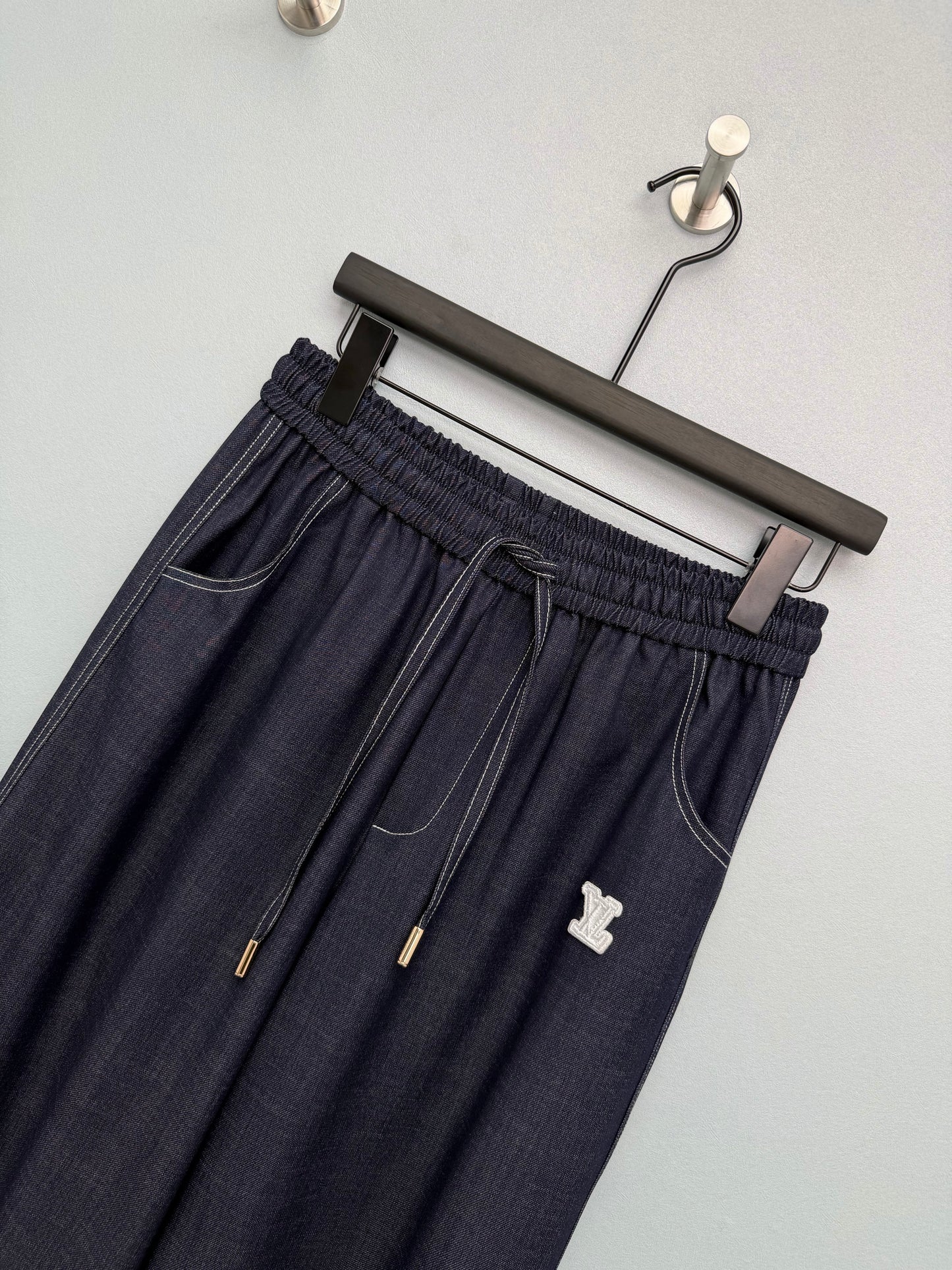 26. Wide-Leg Trousers with Side Drawstrings and Exposed Stitching
